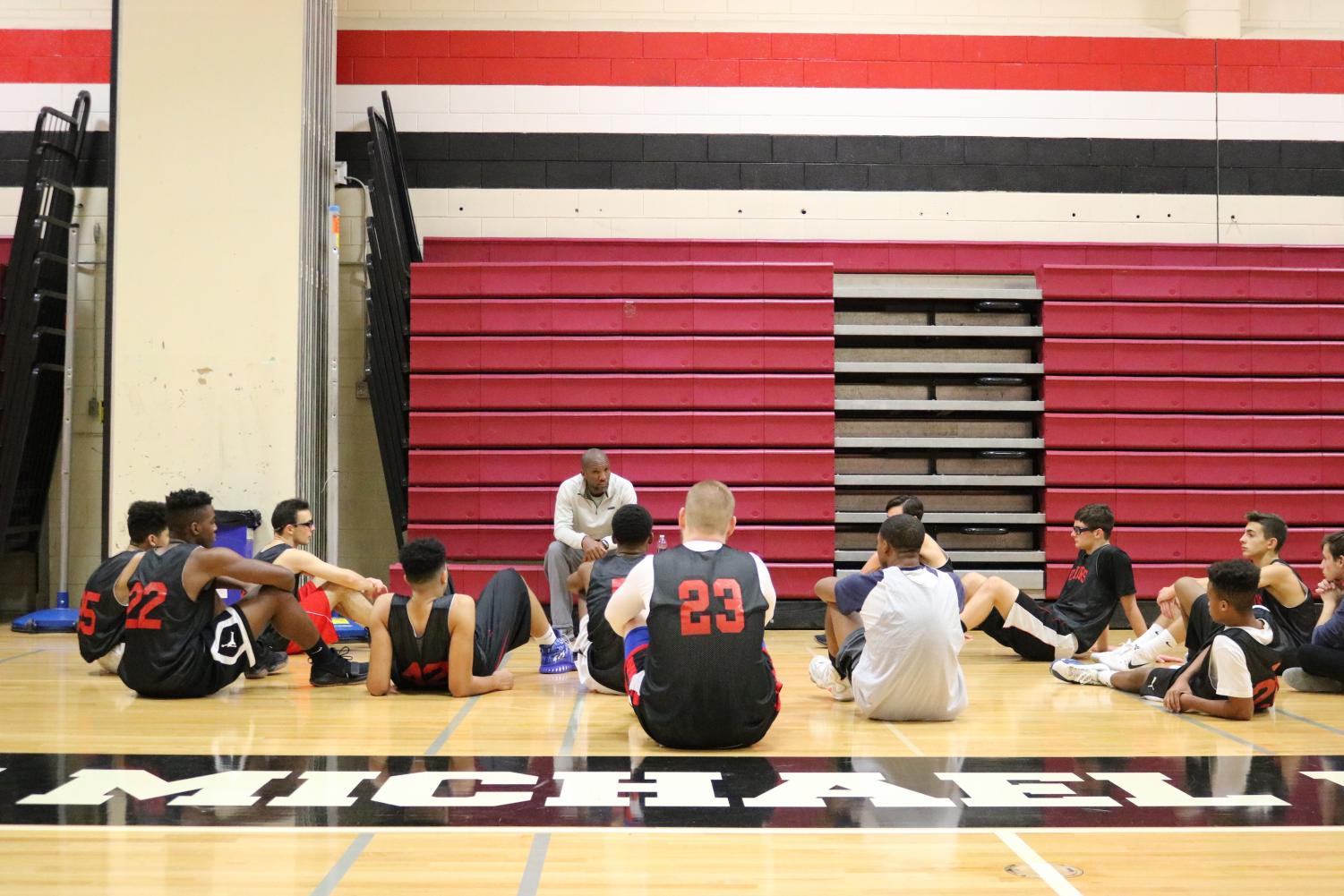 Coach Dortonne talks to the team before practice.