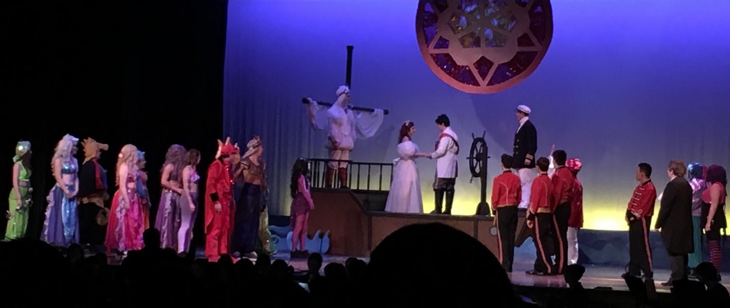 Pat-Med students on stage during the final scenes of The Little Mermaid.