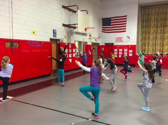 Students at Barton Elementary practicing yoga.