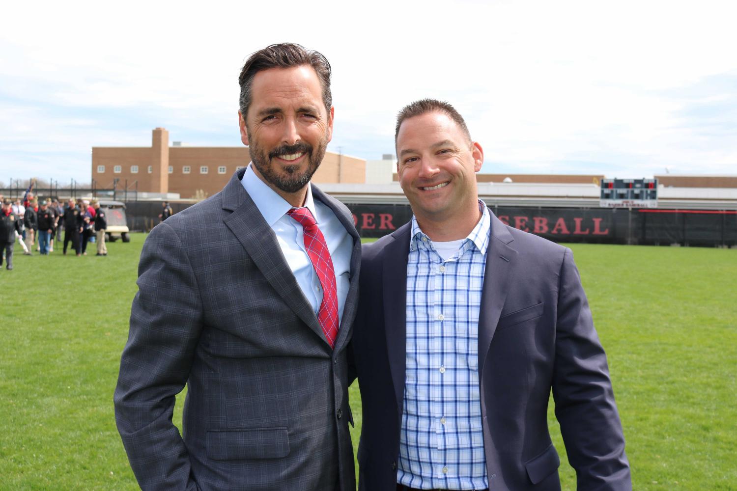Superintendent of Patchogue-Medford School District, Dr. Hynes (left), and our new Athletic Director, Ryan Cox, pose together on the field.