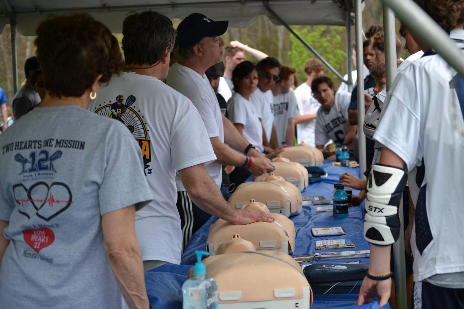 2017 Louis J. Acompora 16th Annual  Memorial lacrosse Jamboree; Teaching hands only CPR to athletes.