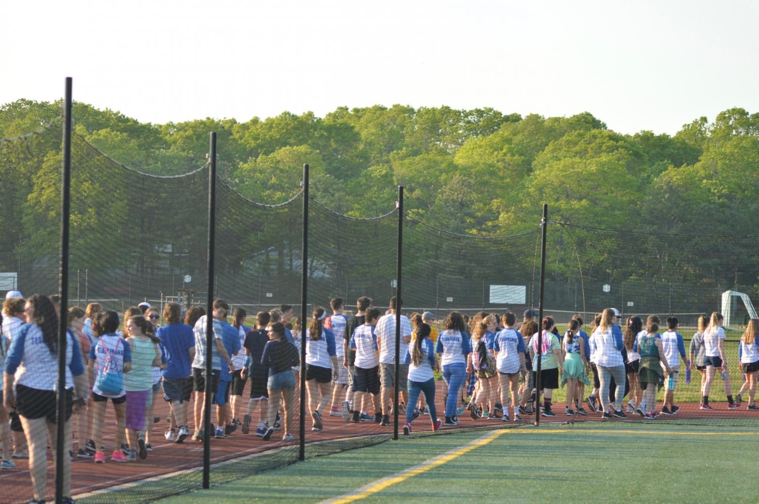 The community walks around the HS track on Thursday, May 18 for ALS: Ride for Life