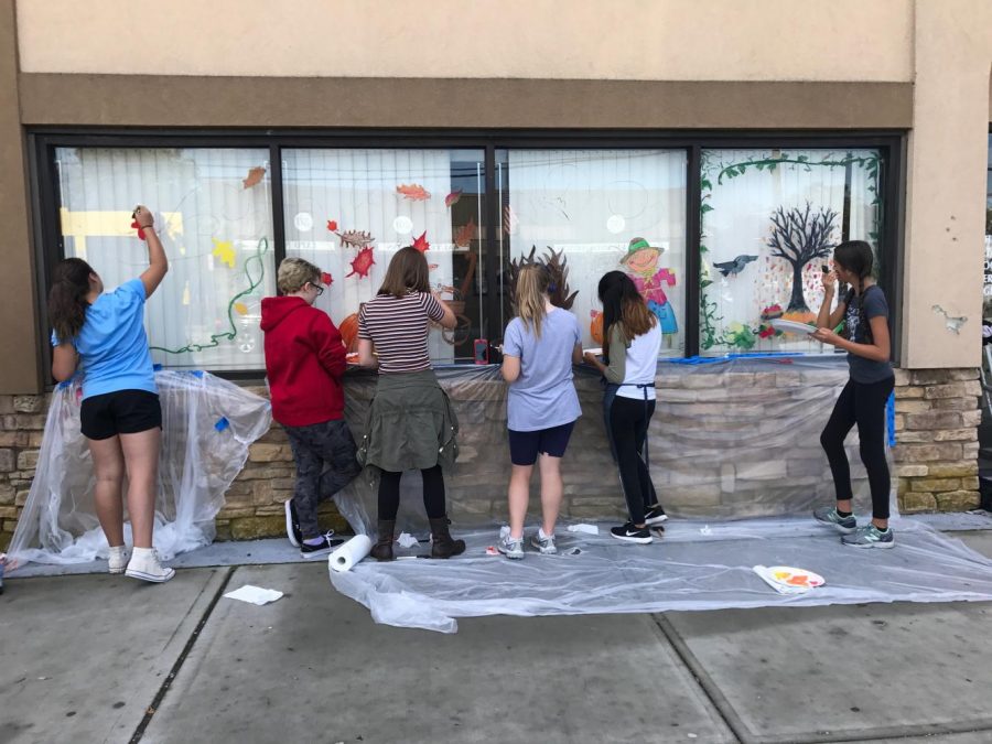 PMHS art students painted seasonal decor on storefront windows along Main  Street in Patchogue.