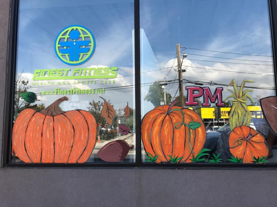 PMHS art students painted seasonal decor on storefront windows along Main  Street in Patchogue.