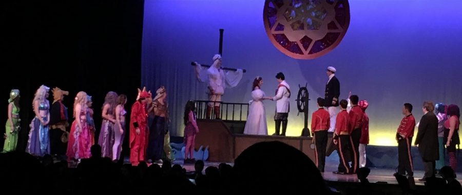 Pat-Med students on stage during the final scenes of The Little Mermaid. 