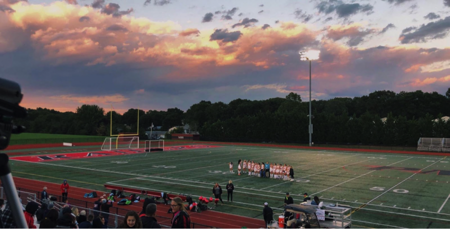 The+Pat-Med+Varsity+Field+Hockey+Teams+lines+up+together+for+the+last+time+before+their+final+game+under+the+lights.+Tonight+was+Senior+Night+and+those+teammates+were+honored.