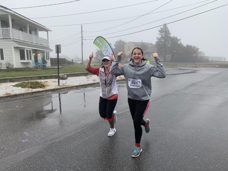 Juniors Kylie Peregoy and Shannon Lake smiling and pushing through even in the rainy weather. Shannon moved on to win 3rd and Kylie won 4th in their division.
