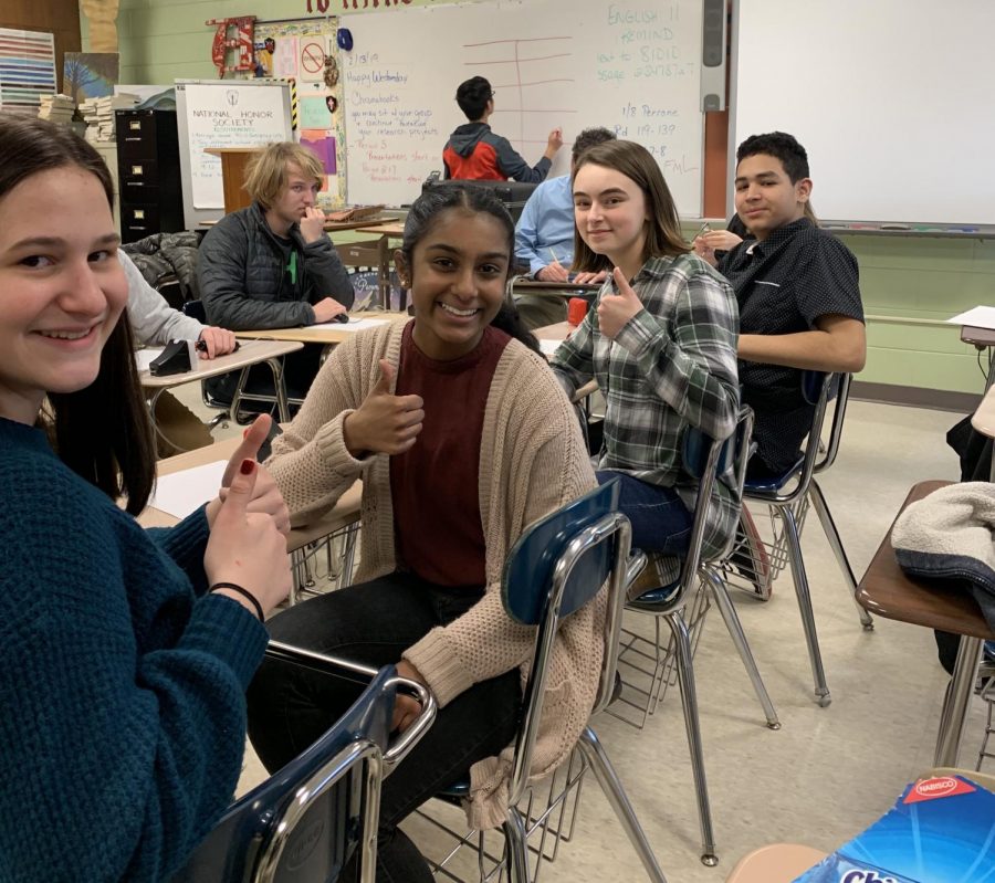 Juniors Sarah Varghese and Meghan OLeary (2nd and 3rd from left) and Sophomore Jeff Tajada offer a thumbs up to encourage newcomer, Esme Warmuth, gr. 9 for her first competition.