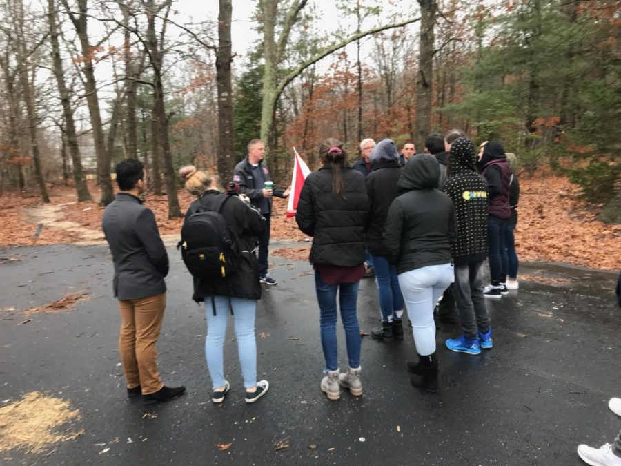 Generation Civics students meet down the road of our high school on a rainy morning to speak with Councilman Neil Foley about a possible new paved road to ease the traffic issues during the morning commute.