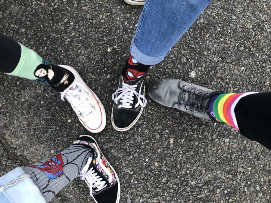 PMHS students showing off their crazy socks in support of Down Syndrome Day
