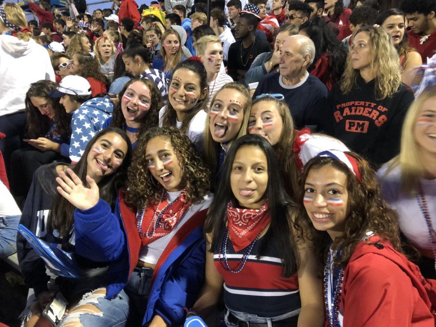 Bottom then top left to right Seniors  (Jessica Panzarino, Shannon Donnelly, Brianna Perez, Makayla Mateo, Stephanie Sheridan, Madison Wyatt, Olivia Hofer and Ana Seifert) showing school spirit in red white and blue at the first themed football game.