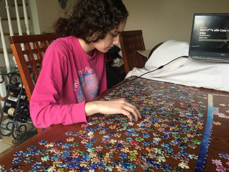 Pat Med senior, Julia works on completing a 1,000 piece puzzle as school shutdown state-wide amid the COVID-19 outbreak.