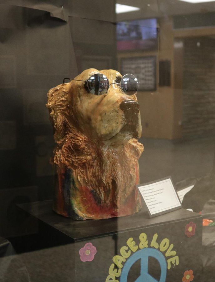 Kristina Mancuso created this tie-dye dog sculpture using elements of realism. 