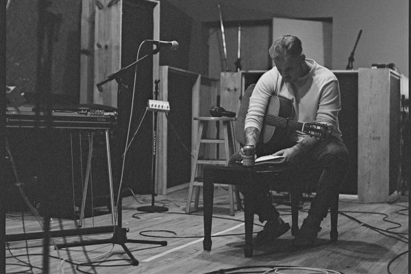 Zach Byran reviewing lyrics and preparing to record his latest album, . I do not and will not fear tomorrow because I feel as though today has been enough, wrote Bryan underneath the post, quoting Fear and Fridays (Poem). thank you for all the love today, I am the luckiest man alive. (Photo provided by @zachlanebryan on Instagram).