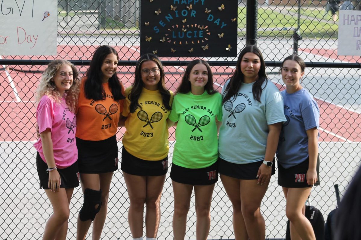 (FROM LEFT TO RIGHT) The Girls' Varsity Tennis team celebrates their Seniors, Gabriella Mannix, Jeraly Tejada, Ceania Gonzales, Amanda Andree, Lucie Lool, and Emma Schneider.