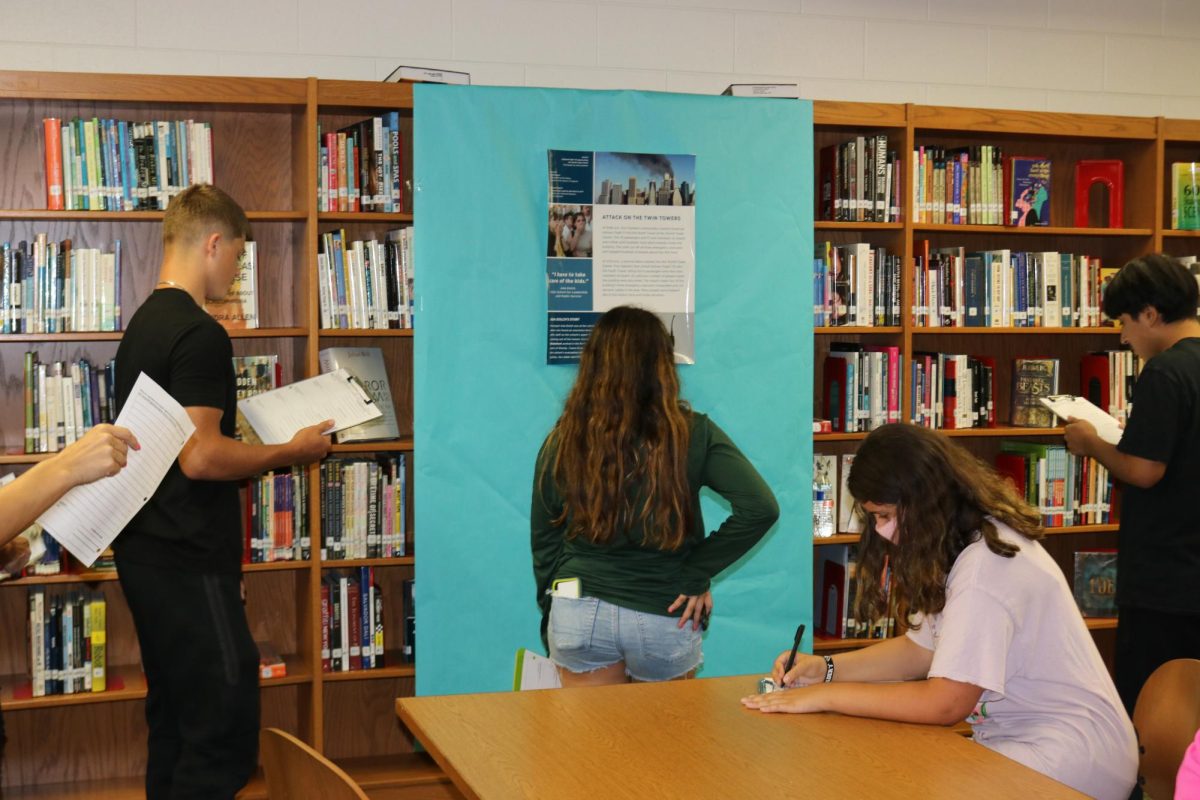 Students are show researching and taking notes on the information shared about 9/11 to commemorate the 22nd anniversary.