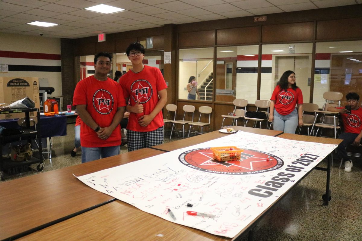 As new students arrived for lunch, class advisers and NHS members asked that they sign their Class of 2027 banner. 