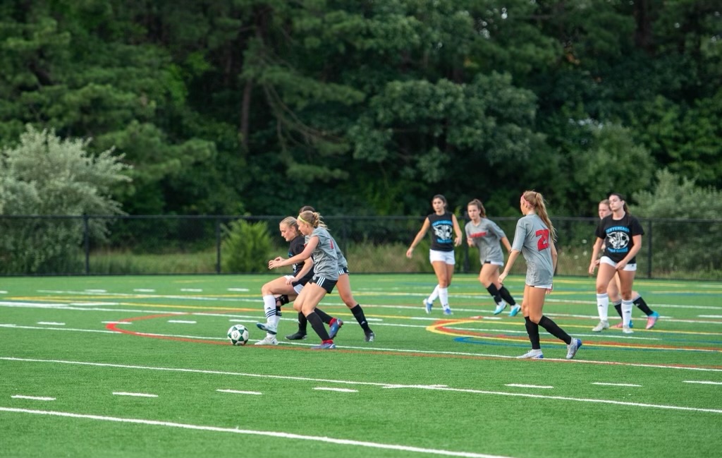 The Girls Varsity Soccer Team plays against Centereach in a summer league matchup.