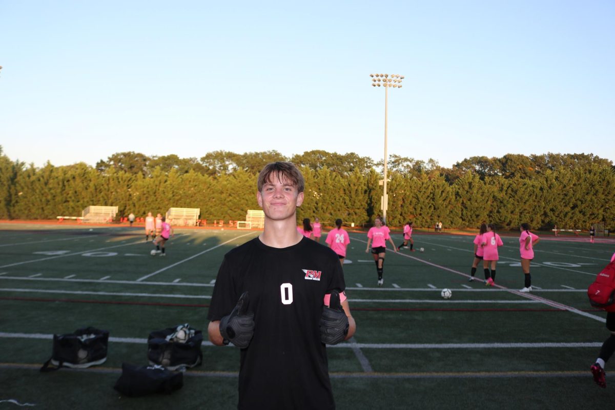 Senior, Team Captain, and goalkeeper Logan Guzik smiles for the camera after the Boys Varsity Soccer Teams Senior Day victory over Riverhead. Guzik was named the League 1 Goalkeeper of the Year following the 2023-24 season, an impressive honor that cements his status as one of the best goalkeepers on Long Island.