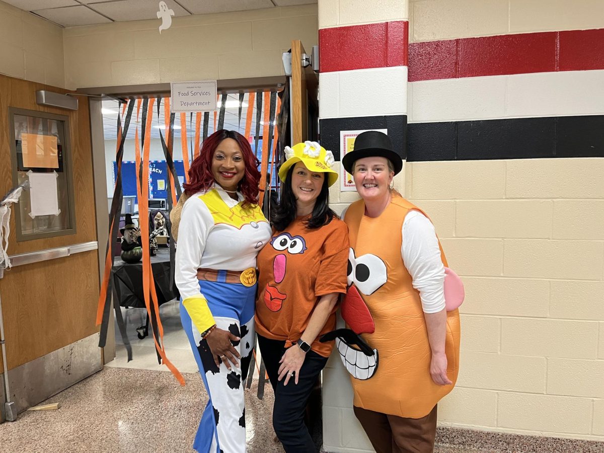 Mr. and Mrs. Potato head hang with Jesse from Toy Story to distribute candy to kids at Trick or Treat Street. 