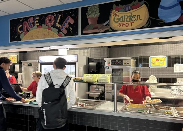 Mrs. Joanne and Mrs. B serving up smiles as well as nachos at the Cafe Olé counter during lunch.