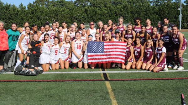 PMHS Varsity Girls Field Hockey posed alongside Bay Shore is to commemorate the anniversary of September 11th. 