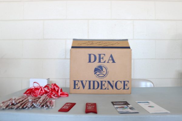 Inventory of DEA items brought to Red Ribbon Week for students, including a DEA evidence box (not for students).