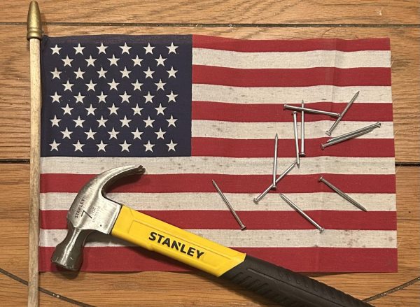 The flag and tools represent the late president's humanitarian work with the Carter Center and Habitat for Humanity organizations, as well as his commitment to serving the nation.