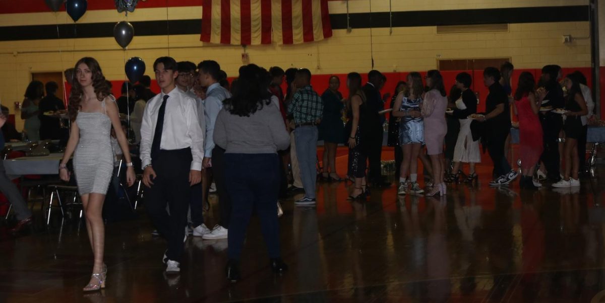 Students line up to get their catered food during the event.