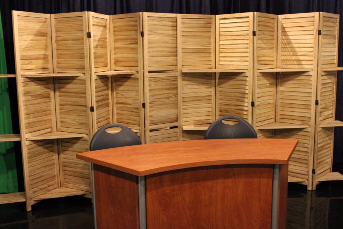 Our Raider TV studio now features a shelving wall, where we can create new scenes with objects and decorations for each part of the school year! We’re excited to premiere our new season of Raider TV. We’ve also hung up some photos of years past to remember our alumni who are now working in the field! 