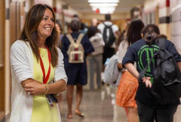 Mrs. Cannetti greeting students in the hallways.
