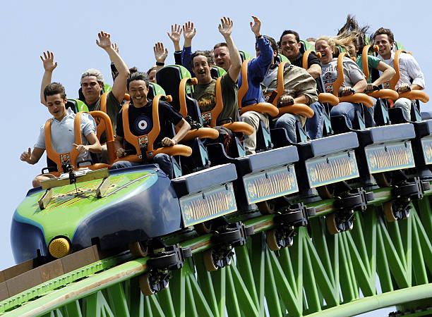 JACKSON, UNITED STATES:  Riders raise their arms as they travel the "Kingda Ka" roller coaster 19 May, 2005, at Six Flags amusement park in Jackson, New Jersey. The roller coaster is billed as the tallest at 456 feet (139 meters) and fastest, 128 mph (205 kph) on the Earth.  AFP PHOTO/Stan HONDA  (Photo credit should read STAN HONDA/AFP via Getty Images)