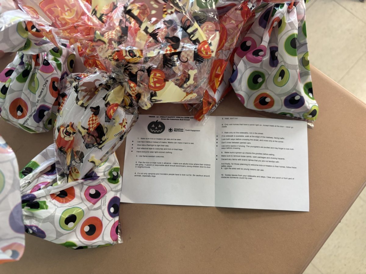 Red Cross club prepares to combine safety with fun when packing bags for Trick or Treat Street.