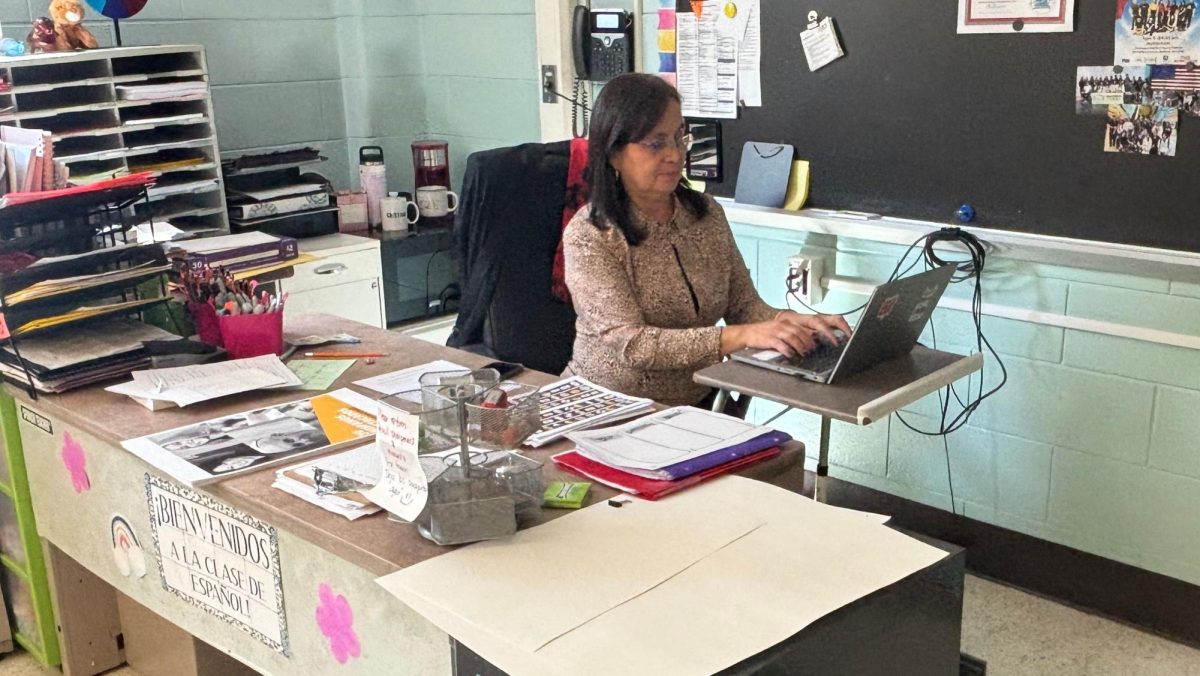 Mrs. Molina worked to prepare to assist students for the day.