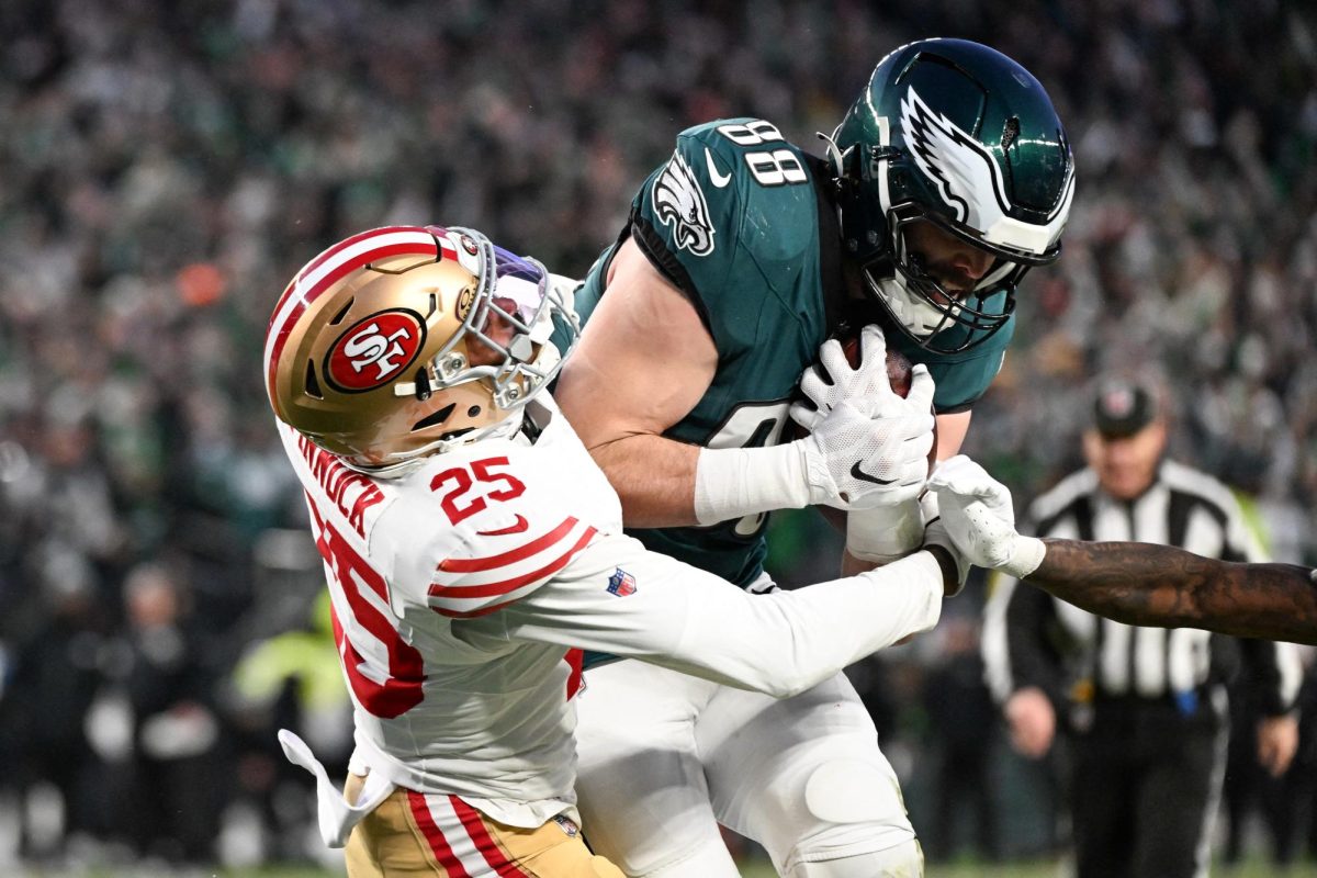 Jan 11, 2026; Philadelphia, PA, USA; Philadelphia Eagles tight end Dallas Goedert (88) scores a touchdown defended by San Francisco 49ers safety Jason Pinnock (25) during the first quarter in an NFC Wild Card Round game at Lincoln Financial Field. Mandatory Credit: Eric Hartline-Imagn Images