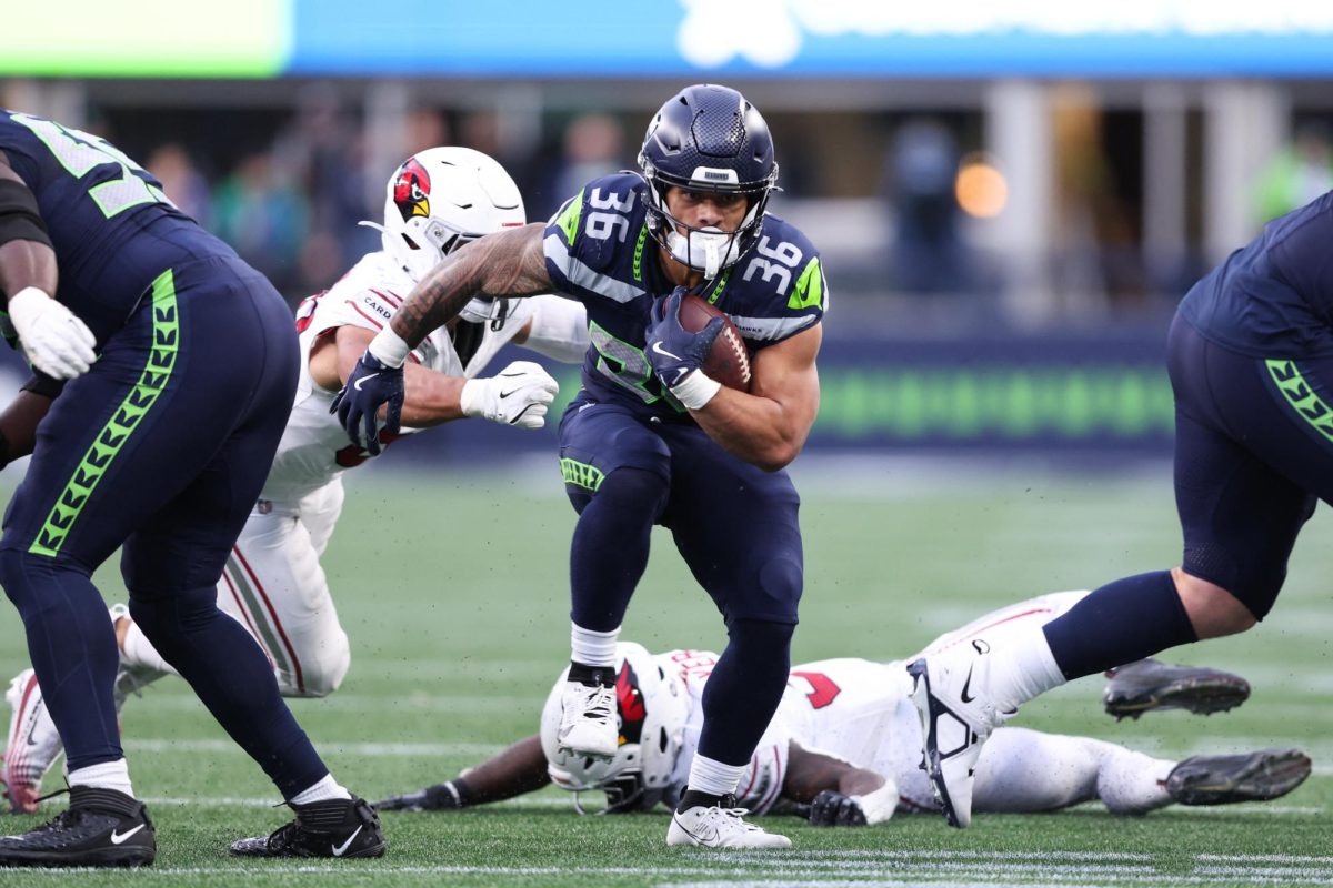 Nov 9, 2025; Seattle, Washington, USA; Seattle Seahawks running back George Holani (36) rushes during the fourth quarter against the Arizona Cardinals at Lumen Field. Mandatory Credit: Kevin Ng-Imagn Images