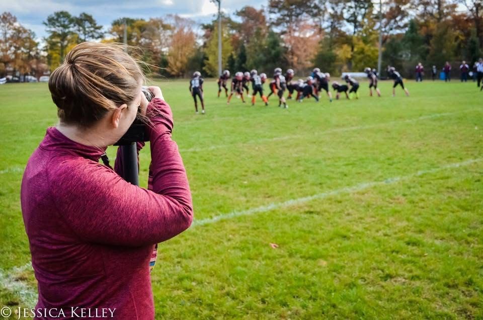 Jessica Kelley doing what she loves best, capturing the moments of action on and off the field.