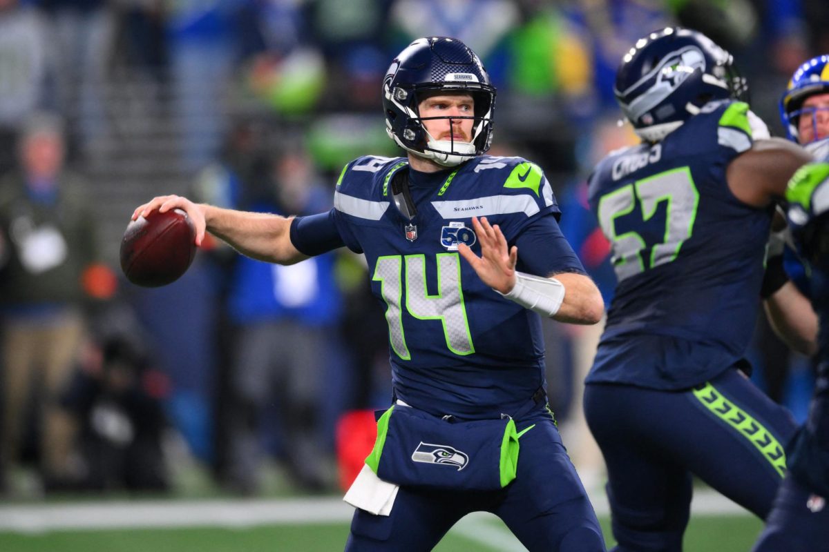 Jan 25, 2026; Seattle, WA, USA; Seattle Seahawks quarterback Sam Darnold (14) passes against the Los Angeles Rams during the second half in the 2026 NFC Championship Game at Lumen Field. Mandatory Credit: Steven Bisig-Imagn Images