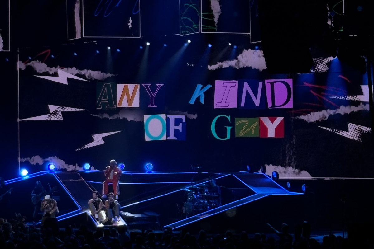 The band, Big Time Rush, performing their hit song, "Any Kind of Guy" at a concert in Jones Beach