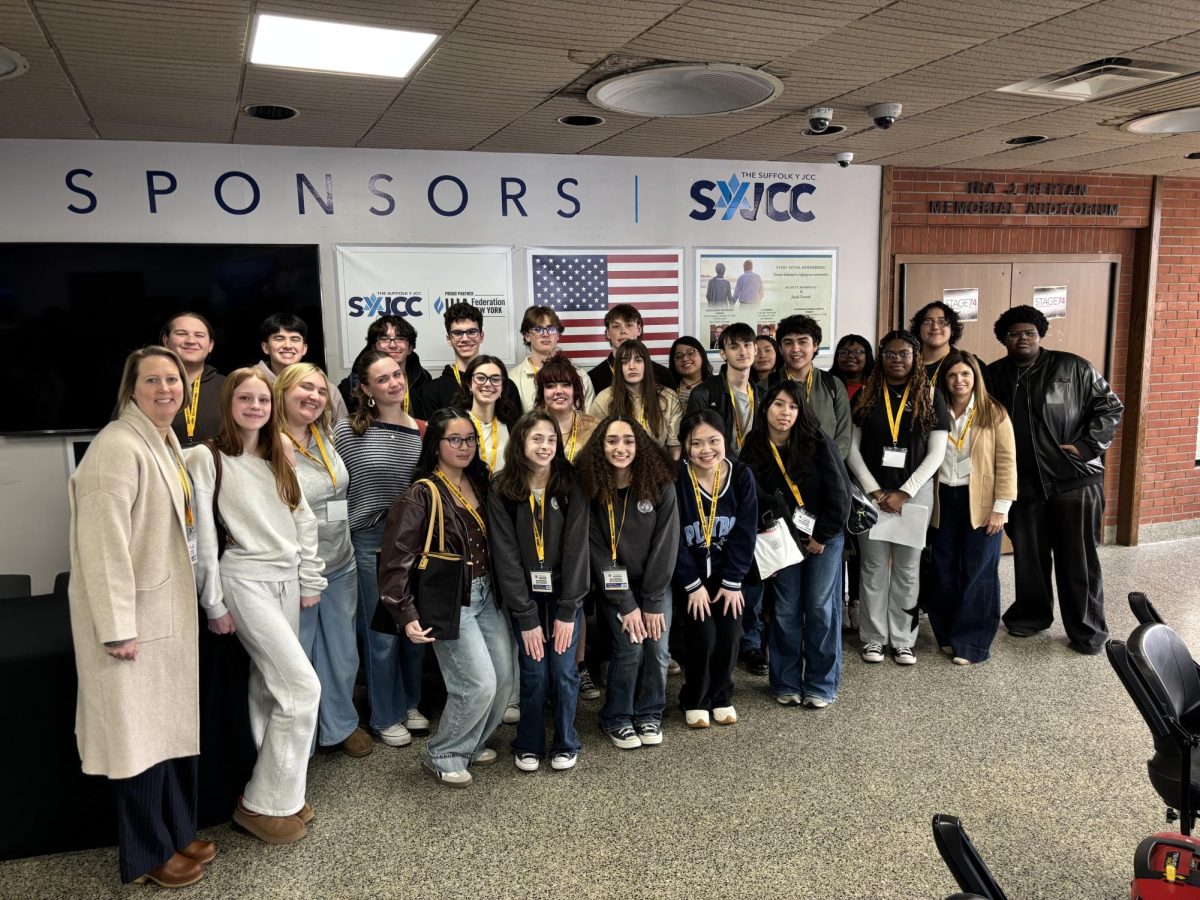Mrs. Sweda and Ms. Carluccio-Roberts AP European Students taking a group photo in front of the auditorium during the YOUnity Conference at the Suffolk Y JJC.