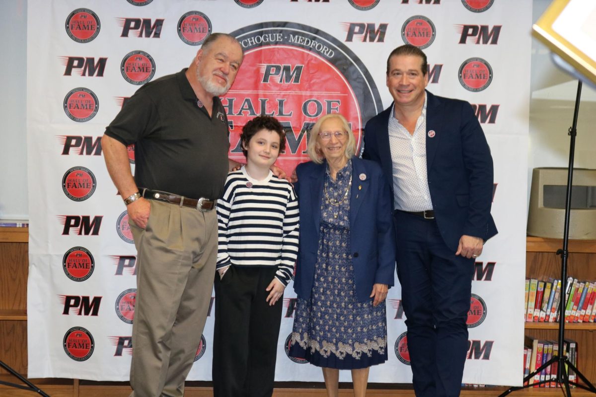 The Hall of Fame's class of 2026 inductees stand together during their celebration breakfast. 
