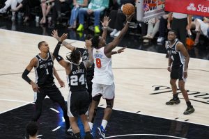 Jun 3, 2026; San Antonio, Texas, USA; New York Knicks forward Og Anunoby (8) drives to the basket past San Antonio Spurs guard Devin Vassell (24) during the fourth quarter during game one of the 2026 NBA Finals at Frost Bank Center. Mandatory Credit: Daniel Dunn-Imagn Images