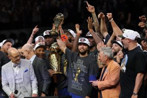 Jun 13, 2026; San Antonio, Texas, USA; New York Knicks guard Jalen Brunson holds the Finals MVP trophy during the championship celebration after game five of the 2026 NBA Finals against the San Antonio Spurs at Frost Bank Center. Mandatory Credit: Geoff Burke-Imagn Images