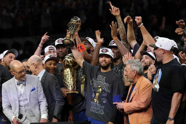 Jun 13, 2026; San Antonio, Texas, USA; New York Knicks guard Jalen Brunson holds the Finals MVP trophy during the championship celebration after game five of the 2026 NBA Finals against the San Antonio Spurs at Frost Bank Center. Mandatory Credit: Geoff Burke-Imagn Images